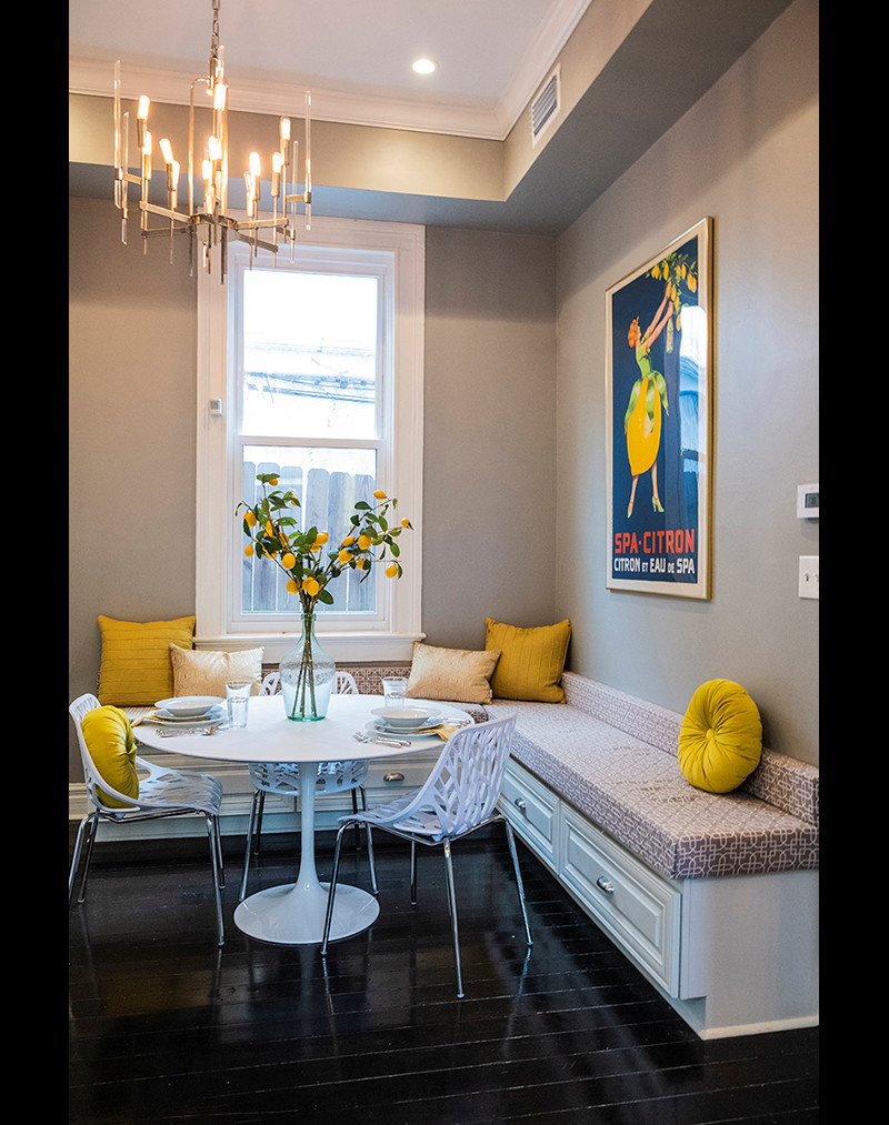 Bright and Cheery Breakfast Nook with built in storage, yellow throws, lemon centerpiece